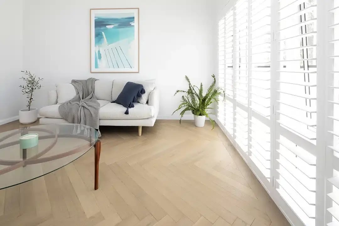 Coastal living room with French oak flooring in a bright, airy Perth home