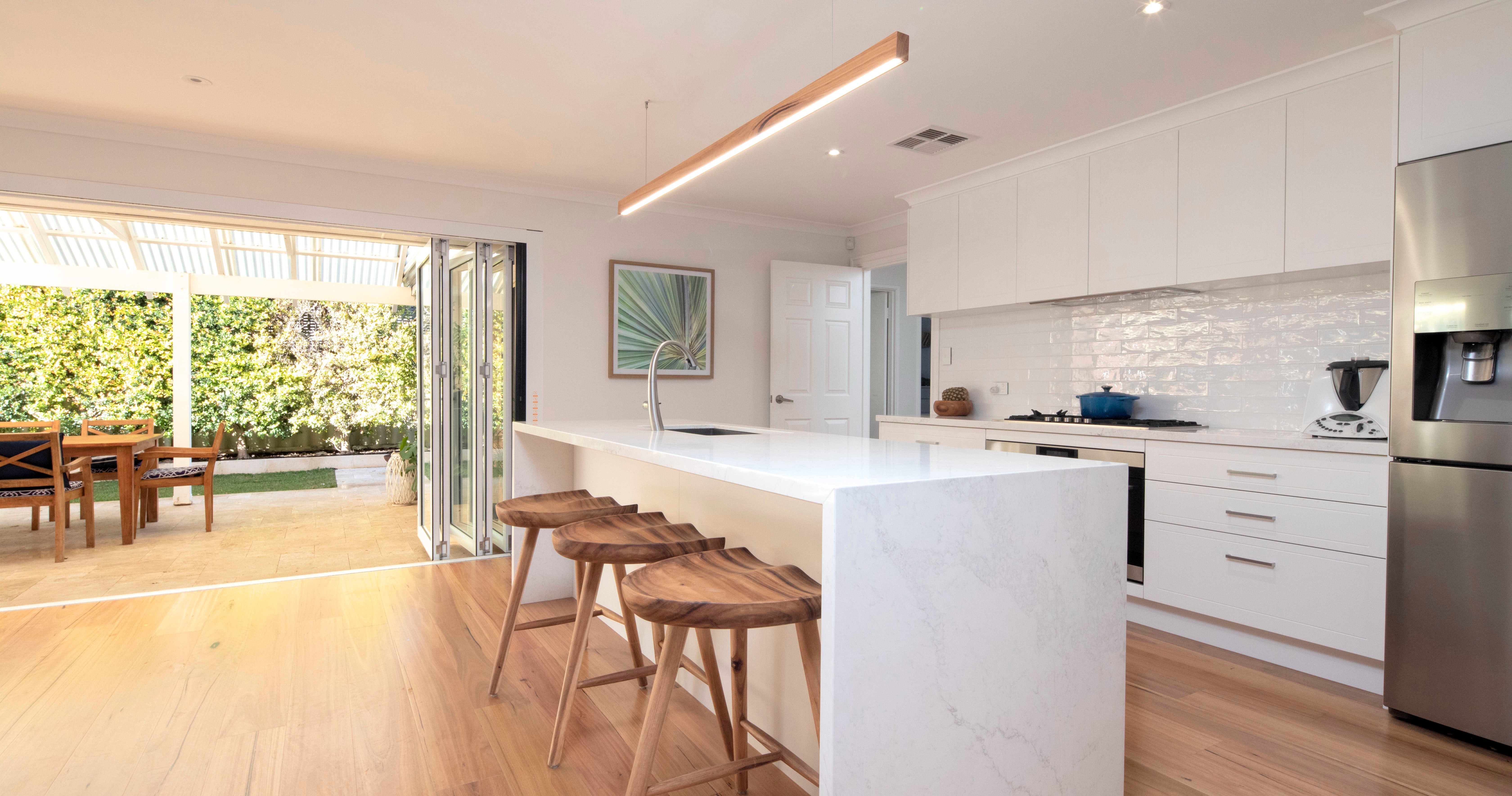 Hardwood timber flooring in a bright open-plan Perth home, comparing the warmth of timber vs bamboo flooring