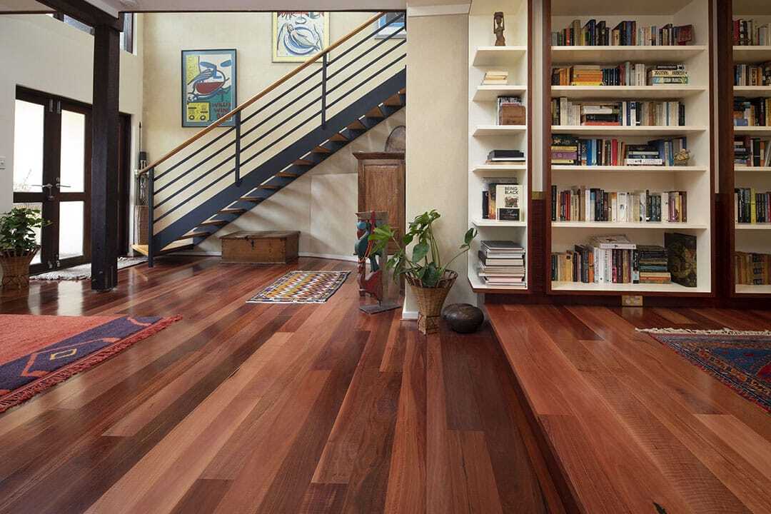 Jarrah timber flooring in 180mm boards installed in a Perth home, deep red-brown with black gum vein