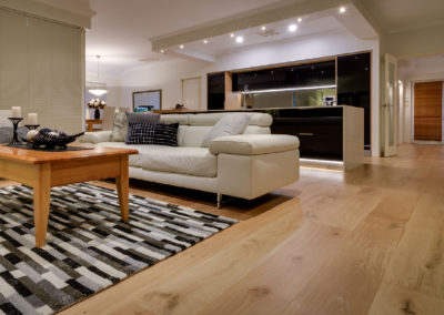 Living area connecting to kitchen with Oak timber flooring