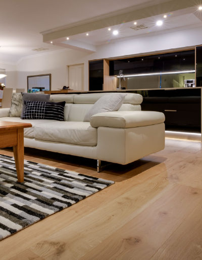 Living area connecting to kitchen with Oak timber flooring