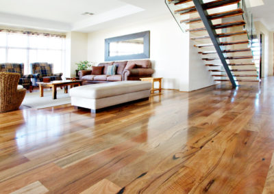 Australian hardwood Marri timber flooring laid in family area with staircase