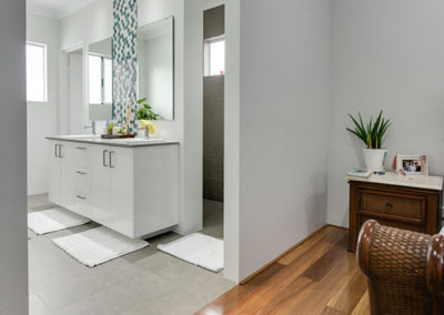 Bathroom tiled area connected to Spotted Gum timber floor