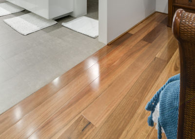 Australian Spotted Gum floor connecting to bathroom tiled area