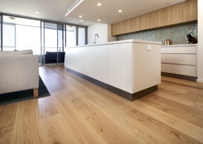 French Oak flooring with kitchen bench and open plan windows