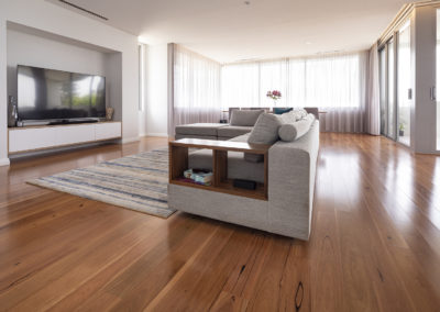 Blackbutt timber flooring in open plan lounge room and dining area