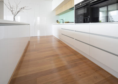 Kitchen covered in Blackbutt timber flooring