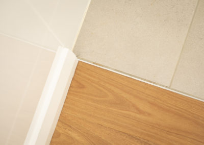timber floor flush with tiles in bathroom area