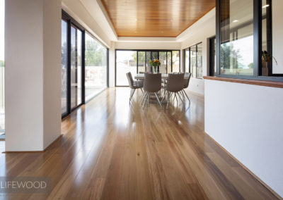 Lower level passageway with Blackbutt timber flooring in dining area