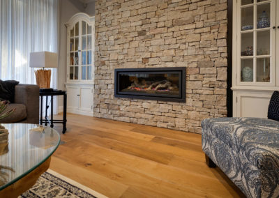 Smoked engineered oak flooring in front of fireplace