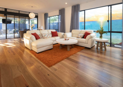 Open plan living room in Perth home with timber flooring