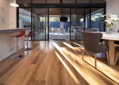 living area extending to back patio covered with Blackbutt timber