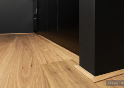 WA Blackbutt Flooring against black wall