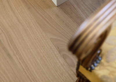 close up of timber grain in blackbutt flooring with skirting